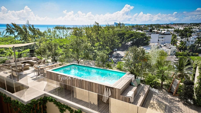 Appartement pieds dans l'eau à vendre à Grand Baie, 384m², 4 chambres, garage, piscine commune, vue mer, accès mer €.